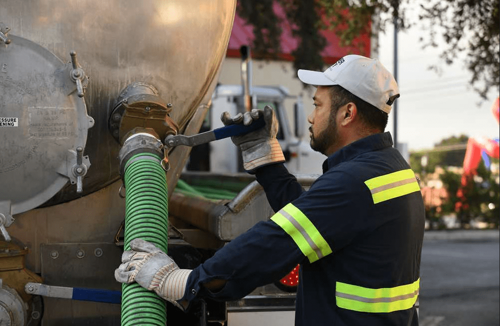silver city representative repairing his truck